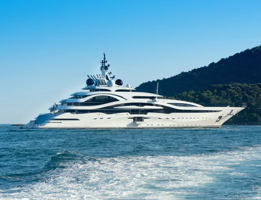 Superyacht cruising along a coastline